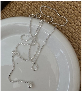 Macro detail of S925 sterling silver beaded necklace with adjustable sliding ring clasp