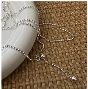 Detailed view of adjustable S925 silver beaded necklace with sliding buckle closure