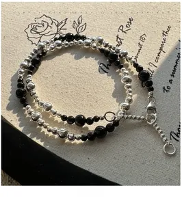 Detail of S925 sterling silver black agate beaded necklace with lobster clasp and chain