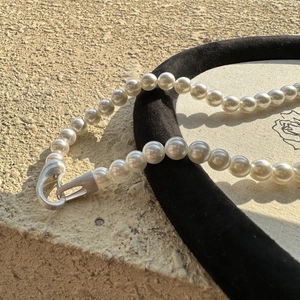 S925 silver beaded necklace with white pearls and a brushed matte finish buckle on stone