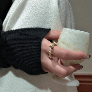 Minimalist 925 silver beaded ring with gold-tone accents and sparkling zircon stones