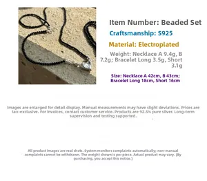 Detail of S925 silver irregular heart pendant on black onyx beaded chain necklace