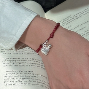 Minimalist S925 silver heart and bell on red string bracelet for women on wrist