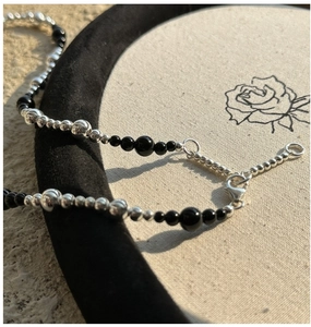 Detail of S925 sterling silver beaded necklace with black onyx and lobster clasp closure