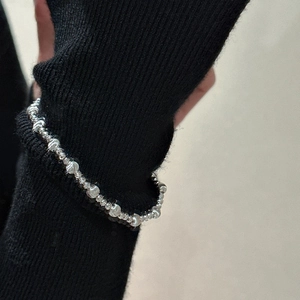 Minimalist S925 sterling silver beaded bracelet with cat eye effect beads on black sleeve