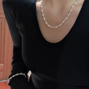 Elegant S925 sterling silver beaded necklace and bracelet set on a model