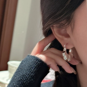 Elegant S925 sterling silver hoop earrings with a wide wavy textured metal finish
