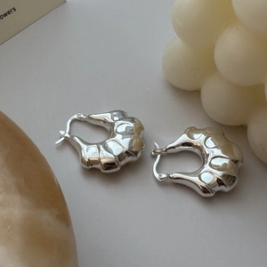 Minimalist S925 sterling silver hoop earrings with irregular fluid metal texture design