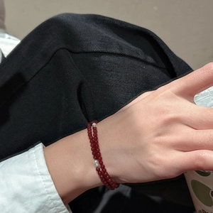 925 silver red agate multi-wrap beaded bracelet with silver accents worn on a wrist
