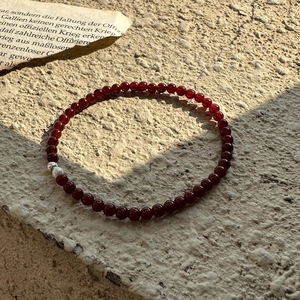 Minimalist 925 silver red agate beaded bracelet with fresh water pearl on stone background