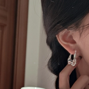 Minimalist S925 sterling silver hoop earring with irregular liquid metal texture on ear