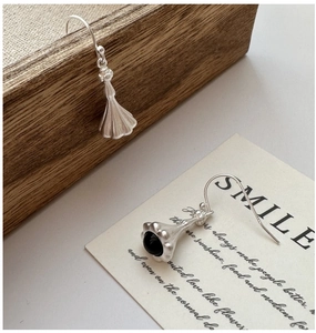 Macro view of S925 sterling silver matte drop earring with black onyx stone inlay