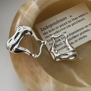 Minimalist S925 sterling silver hoop earrings with irregular lava texture in a creative design