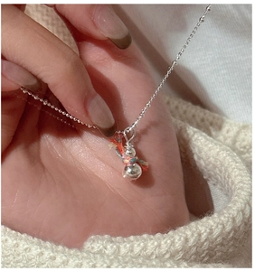 Detailed close-up of a 925 silver snowman pendant necklace with colorful thread accents