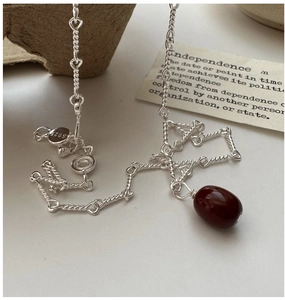 Detail of S925 sterling silver chain with deep red agate pendant and silver hallmark