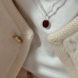 Elegant S925 silver necklace with a deep red oval bean pendant on a minimalist chain