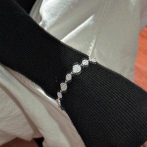 Elegant S925 sterling silver chain bracelet with textured round links on a black knit sleeve