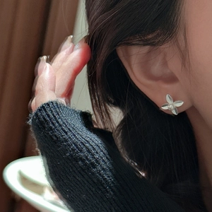 925 silver leaf flower stud earring with pearl accent shown on a model ear