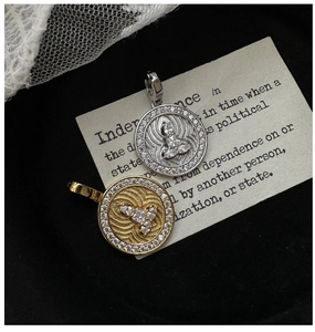 Close-up of S925 silver Buddha pendant with pave crystals and wave textures