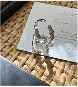 Close-up of S925 sterling silver ring with molten lava texture and hallmark engraving