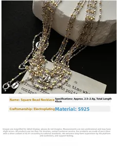 Detail of S925 sterling silver multi-strand necklace with gold square beads and plated finish