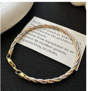 Macro detail of tricolor S925 silver braided bracelet with lobster clasp and Italy hallmark