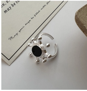 Macro detail of S925 sterling silver sunburst ring with black agate inlay and S925 hallmark