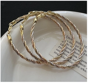 Detailed view of Italian style S925 silver tricolor woven bracelets with lobster clasp