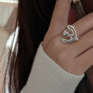 Minimalist S925 silver peace dove ring with an abstract bird design worn on a finger