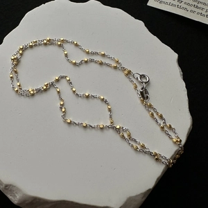 S925 sterling silver necklace featuring two-tone gold and silver minimalist beads
