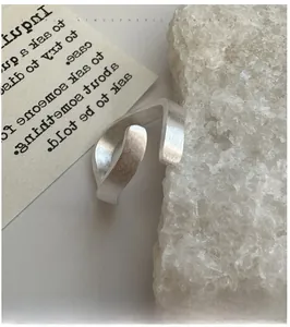 Macro shot of S925 sterling silver ring featuring a unique brushed matte metal texture