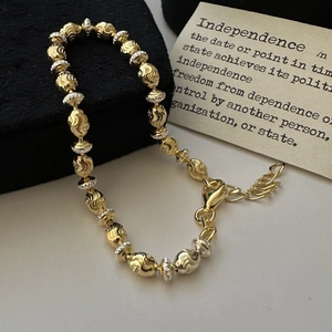 S925 sterling silver two-tone beaded bracelet with textured metal beads and lobster clasp