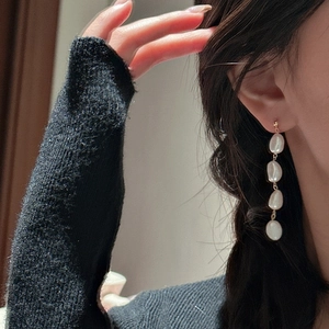 Elegant long drop earrings with four white baroque pearls in gold-plated S925 silver