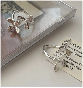 Detail of S925 sterling silver floral rings with an artistic petal texture design