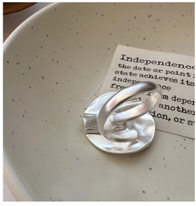 Macro detail of S925 sterling silver ring featuring a hammered texture and inner hallmark