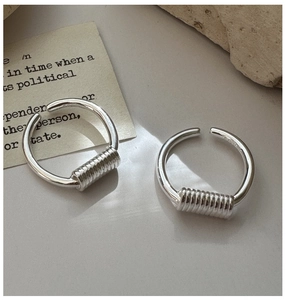 Detailed view of S925 sterling silver open rings with minimalist wire wrap texture