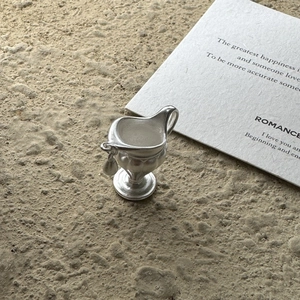 Minimalist S925 sterling silver water bottle pendant with matte finish on stone surface