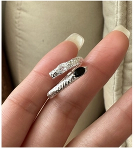 Detail of S925 sterling silver twist ring with marquise cut black and white stones