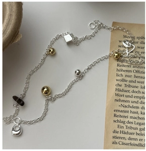 Macro shot of S925 sterling silver hallmark on geometric smoky quartz pendant necklace