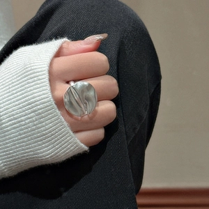S925 sterling silver ring with textured matte organic surface worn on finger
