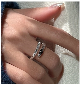 Detail of S925 sterling silver wrap ring with twisted texture and black marquise stone