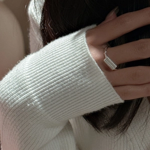 Minimalist S925 sterling silver ring with delicate wire wrap design on a female finger