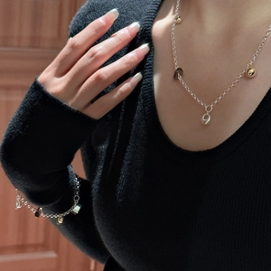 Elegant S925 sterling silver jewelry set featuring smoky quartz pendants and gold beads