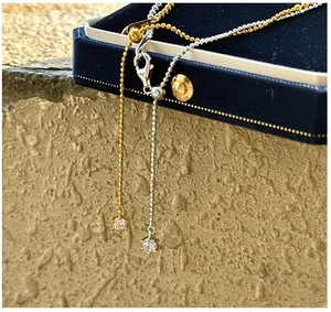 Macro detail of S925 sterling silver necklaces with adjustable sliders and round zircon stones