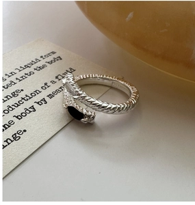 Detail of S925 sterling silver cross ring with black gem and tiny zircon stone