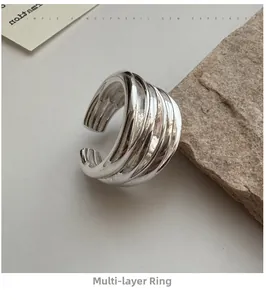 Macro shot of a layered silver S925 ring featuring a polished finish and minimalist design