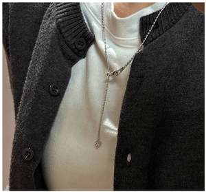 Close-up of S925 sterling silver adjustable draw-string necklace with zircon pendant