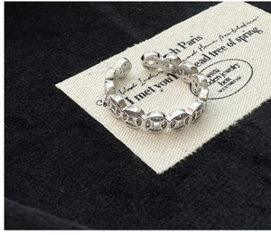 Detail of S925 silver adjustable ring with ancient coin patterns and inlaid zircons