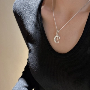 Minimalist S925 sterling silver crescent moon necklace with star pendant on model