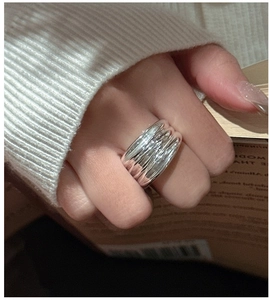 Close-up of S925 sterling silver multilayer ring with unique wavy water ripple texture